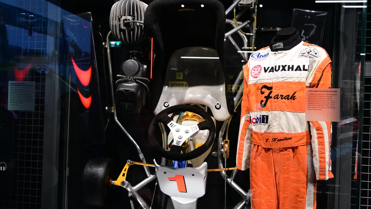 Last Minute Driver Costume Karting Apparel Setup Beginner karting racing overalls and helmet setup showing accessible entry-level driver garments